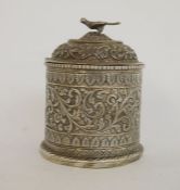 Two Burmese silver-coloured metal trinket boxes, one rectangular with hinged lid, stylised floral
