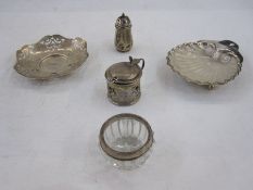 Silver pepperette, a silver mustard pot holder (lacking glass liner), a silver-rimmed salt, a