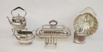 Silver-plated kettle/teapot on paraffin stand, a sugar dish, a toast rack, a lidded tureen, a