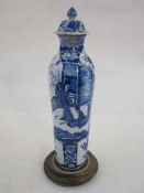 Chinese-style delft slender shouldered and tapering vase with panels of ladies in garden, in