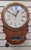 Oak drop-dial wall clock, the circular dial inscribed Marsh, Norwich, glass aperture below flanked