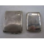 Silver engine-turned cigarette case and a plain silver cigarette case with engraved initials (2)