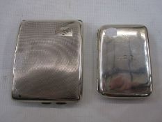 Silver engine-turned cigarette case and a plain silver cigarette case with engraved initials (2)