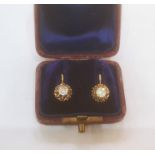 Continental gold-coloured metal and diamond earrings, the circular old cut stone in ornate pierced