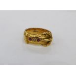 18ct gold, ruby and diamond buckle ring, set two small rubies and one diamond, with scroll