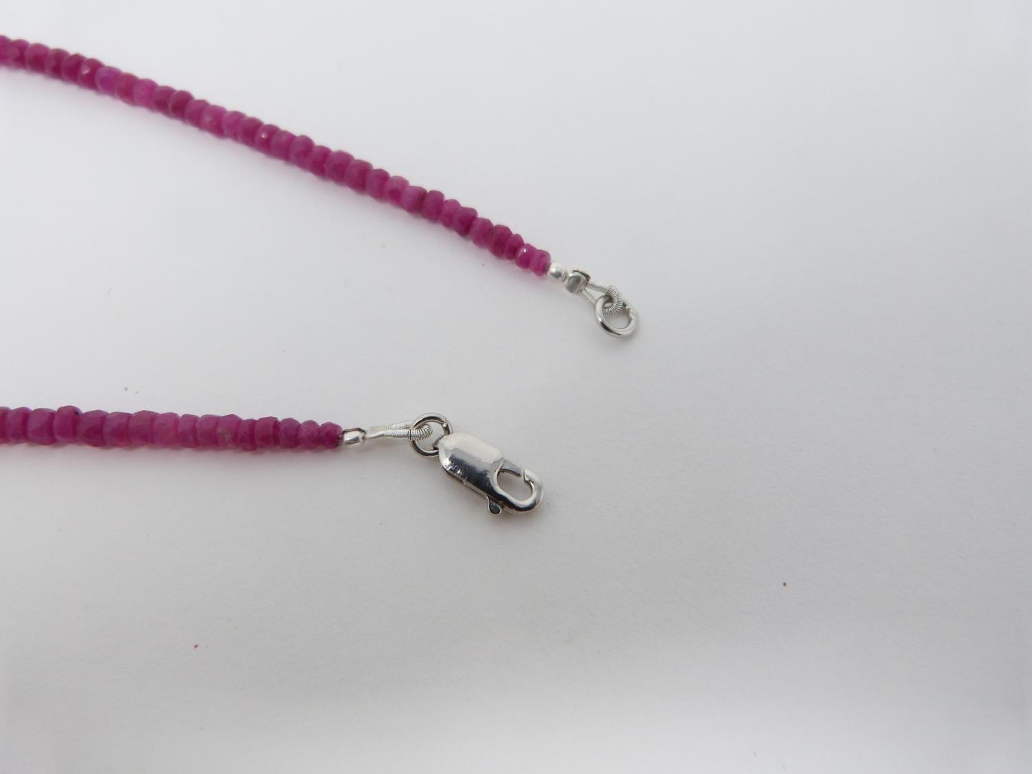 A faced graduated bead Madagascan Ruby necklace, with a total approximate weight of 75.00 carats. It - Image 3 of 4