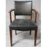 A vintage oak armchair in faux leather on square supports. H.85cm