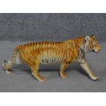 A Franklin Mint 'On The Prowl' porcelain hand painted striding tiger by George Mc Monigle .