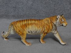 A Franklin Mint 'On The Prowl' porcelain hand painted striding tiger by George Mc Monigle .