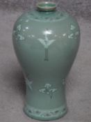 A 20th century Korean Blue celadon crackle glaze vase with crane and cloud decoration. Artist