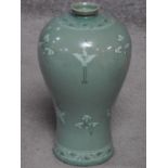 A 20th century Korean Blue celadon crackle glaze vase with crane and cloud decoration. Artist