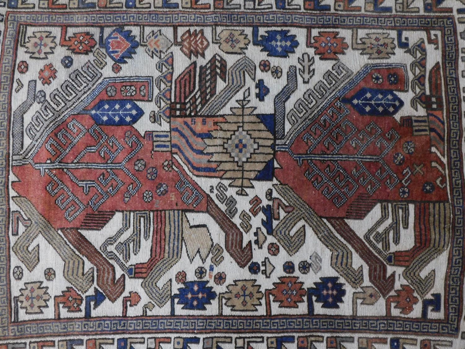 An Anatolian rug with ornate geometric design on ivory ground surrounded by multi geometric - Image 2 of 4