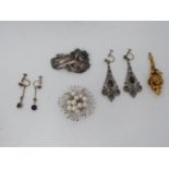 A collection of costume jewellery. Including a cultured pearl and silver floral design brooch, a