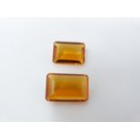 Two GGIL (Global Gems International Laboratories) certified rectangular emerald cut AAA grade