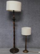 An oak turned standard lamp with circular base along with an oak turned table lamp with rope