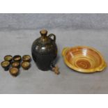 A collection of Mid Century Cooper Pottery studio glazed stoneware pieces including a tapped flagon,