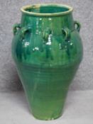 A large green drip glazed sharab wine vessel with multiple handles. H.70cm