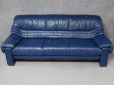A contemporary World of leather three seater sofa in blue leather upholstery. H.80 W.205 D.83cm