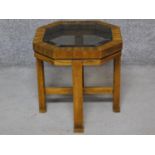 An American walnut coffee table with drop in smoked plate glass top. H.44 W.42 D.42cm