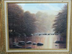 A gilt carved wood framed oil on canvas river landscape by British artist D J Lawrence. Titled' Tarn