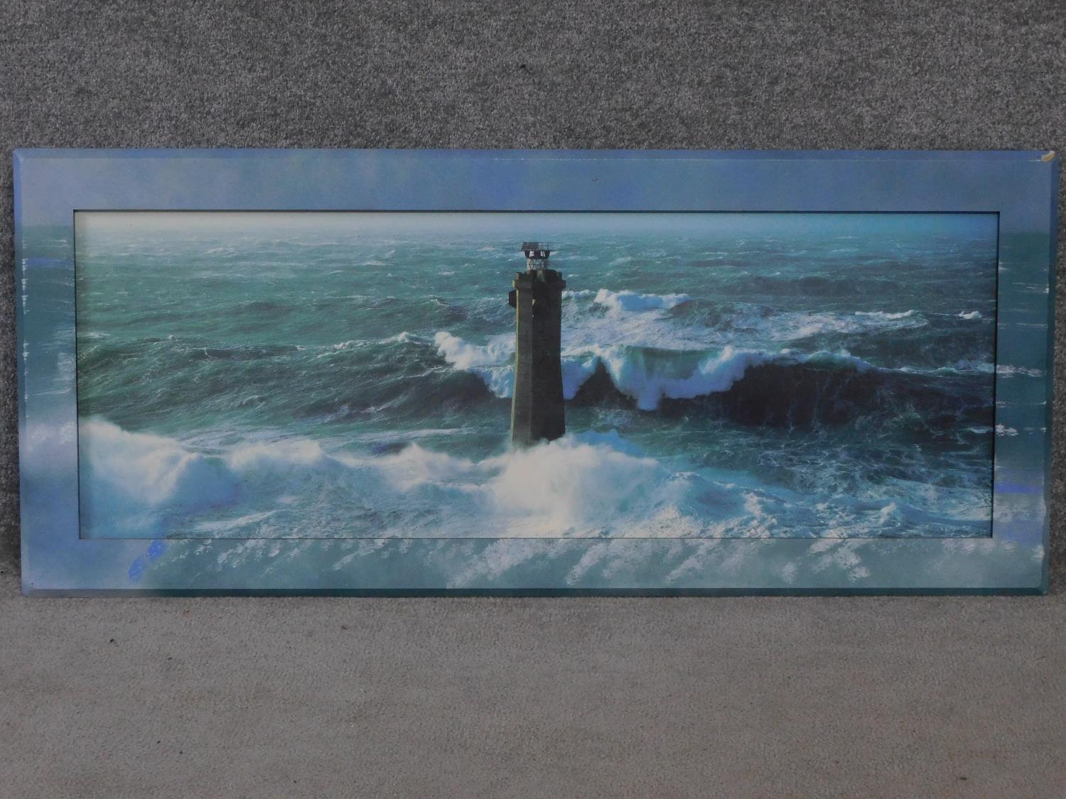 A large framed print depicting a lighthouse in a stormy sea. 134x58cm - Image 2 of 3