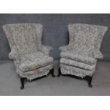 A pair of vintage beech framed Parker Knoll wingback armchairs. H.97cm
