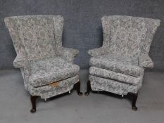 A pair of vintage beech framed Parker Knoll wingback armchairs. H.97cm