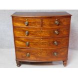 A Regency bowfronted flame mahogany chest of two short over three long graduated drawers fitted with