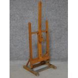 A small Daler Rowney beech wood artists easel. Makers label to front. H.87 W.33 W.31cm