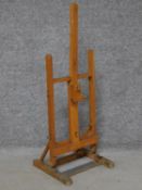A small Daler Rowney beech wood artists easel. Makers label to front. H.87 W.33 W.31cm