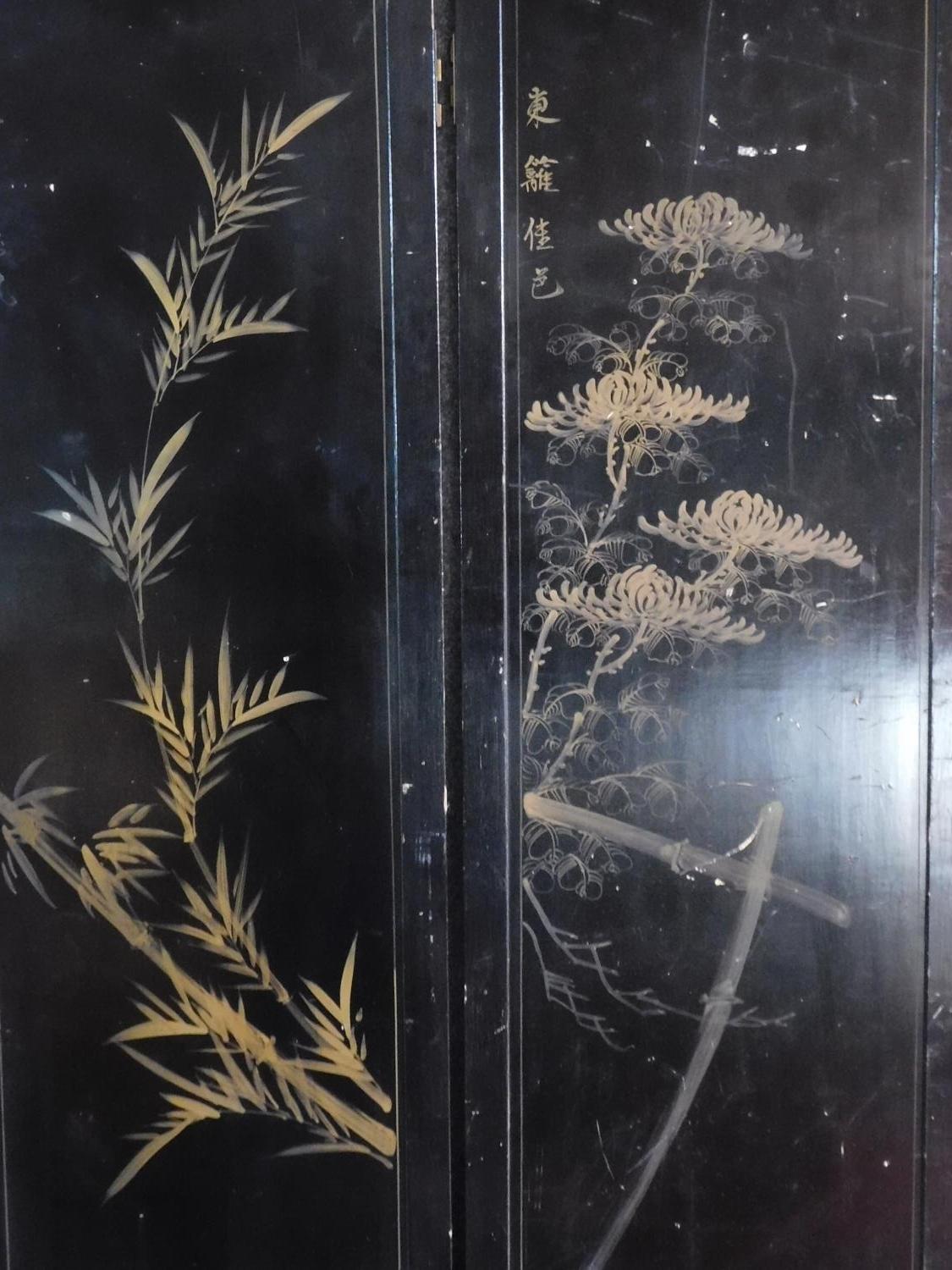 A Japanese mother of pearl and bone inlaid black lacquered three fold and four panel screen. H.183 - Image 9 of 15