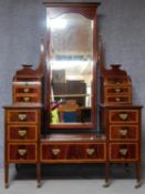 A late 19th century mahogany and satinwood inlaid dressing table fitted with central cheval mirror