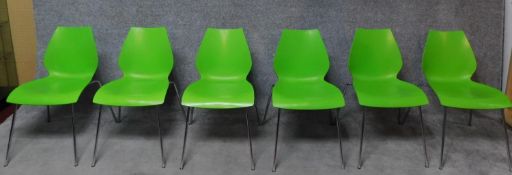A set of six contemporary moulded metal framed stacking chairs. H.76cm