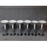 A set of six contemporary moulded adjustable high stools on chrome platform bases. H.87cm