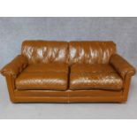 A vintage brown leather upholstered button backed two seater sofa. H.70 W.170 D.90cm