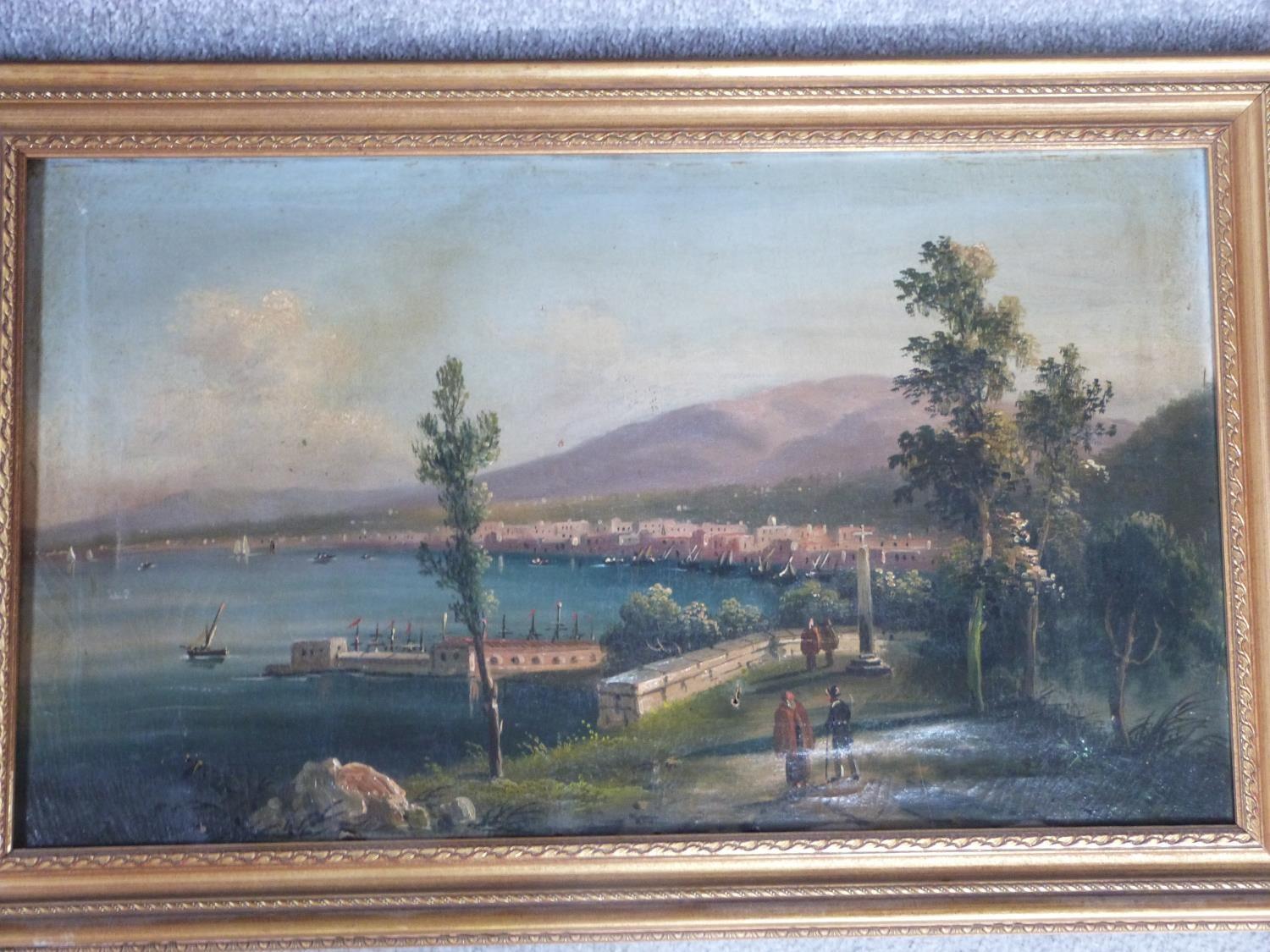 A giltwood framed 19th century oil on canvas of an Italian port City with figures on a bridge.