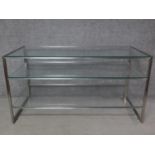 A vintage chrome framed three tier display counter with plate glass shelves. H.82 W.156 D.73cm