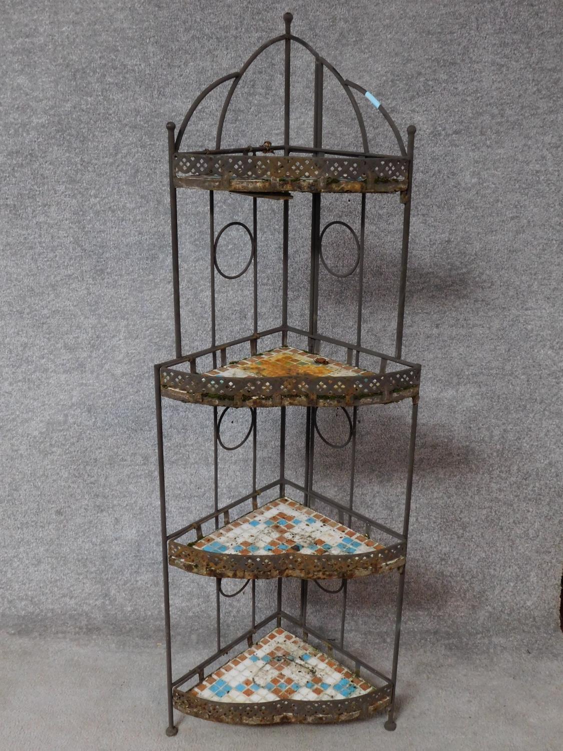 A north African influenced iron framed corner whatnot with mosaic glass tiled shelves. H.138cm