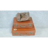 A collection of vintage leather luggage. Including two leather suitcases, one with a patterned