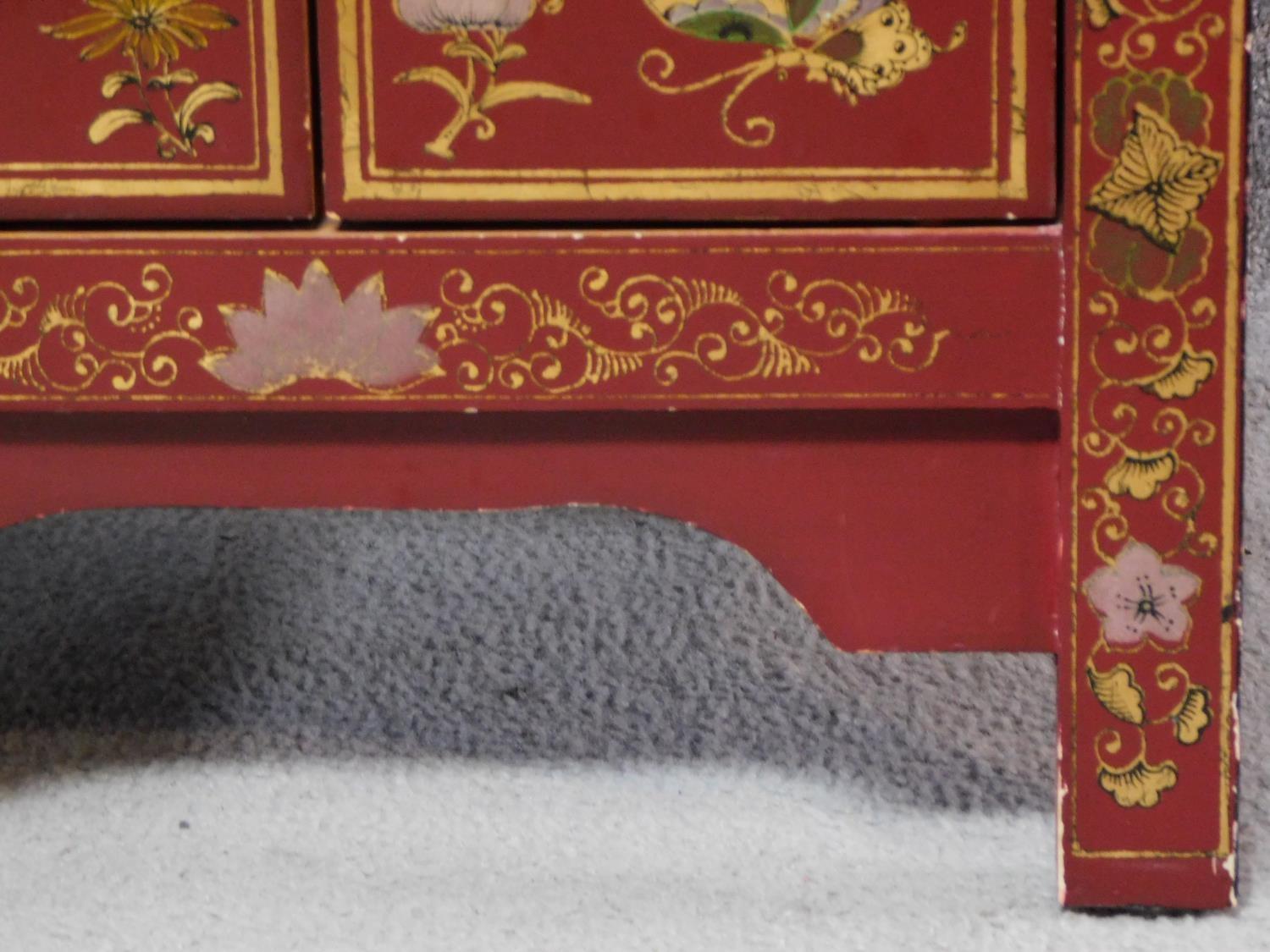 A Chinese red lacquered side cabinet with allover butterfly decoration. H.60 W.40 D.32cm - Image 4 of 6
