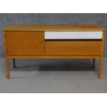 A mid 20th century teak G-plan small sideboard, makers stamp to drawer. H.71 W.133 D.43cm