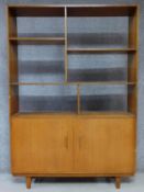 A 1960's vintage teak open bookcase with panel doors to the base. H.178 W.122 D.30cm