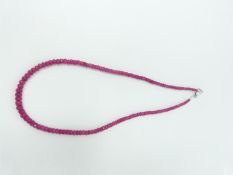 A faced graduated bead Madagascan Ruby necklace, with a total approximate weight of 75.00 carats. It