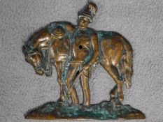 An antique bronze relief wall plaque of a soldier leaning on his horse. Indistinctly signed Jacques.