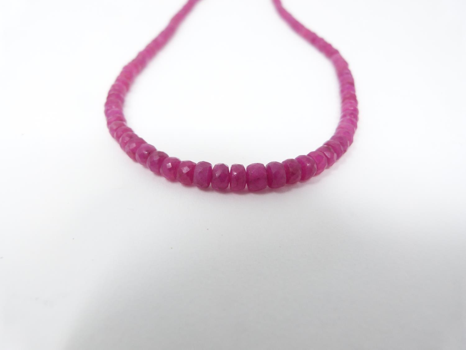 A faced graduated bead Madagascan Ruby necklace, with a total approximate weight of 75.00 carats. It - Image 2 of 4