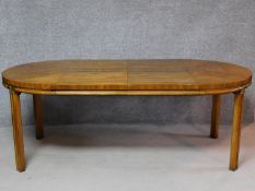 An American walnut Colonial style extending dining table with two extra leaves. H.74 L.203 W.102cm