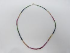 A faceted bead multi gemstone necklace, colour gradient. Total approximate carat weight 25.00