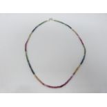 A faceted bead multi gemstone necklace, colour gradient. Total approximate carat weight 25.00