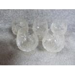 A set of five cut crystal stemmed whisky glasses with star cut bases. H12cm.