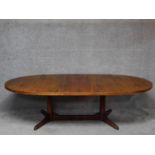 A 1970's vintage rosewood extending dining table. (Includes one leaf) H.71 L.246 W.109cm (fully